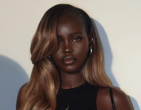 Adut Akech Proves Honey Blonde Is Her Color, And Sets The Tone For The Season’s Hottest Hair Trend